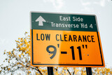 Fototapeta Nowy Jork - Low Clearance sign on the side of the road in Manhattan - New York City. 