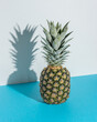 Creative composition with pineapple on blue background. Creative minimal summer concept.
