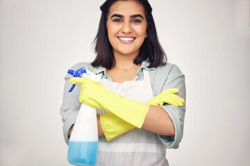 Wall Mural - Woman, portrait and smile with gloves or confidence in house for cleaning, scrub and dirt on window. Housekeeper, happy and apron with detergent in bottle for dust in home on white background