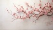 b'A delicate pink cherry blossom branch against a beige background.'