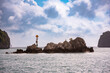 Rocky islands with lighthouse in sea bay in Vietnam