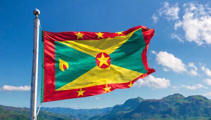 Wall Mural - Die Fahne von Grenada, Karibik, flattert im Wind, isoliert, gegen den blauen Himmel