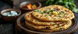 Fototapeta Sport - Indian flatbread stuffed with potatoes, aloo paratha, served with butter or curd. Concept Recipe, Indian cuisine, Vegetarian, Stuffed bread, Homemade