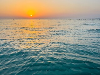 Wall Mural - Orange sea sunset, orange sea horizon, sunshine, evening warm light