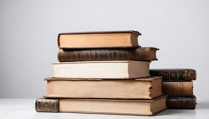 Wall Mural - Stack of old books in a white background