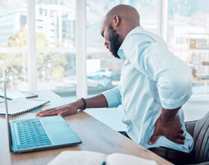 Poster - Businessman, laptop and pain in back in office for tired with muscle injury, job stress and poor posture. Black male consultant, tech and body fatigue by desk with spine problem, strain and scoliosis