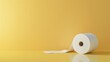 A lone roll of toilet paper unrolling gracefully on a soft beige background with ample copy space on the right.