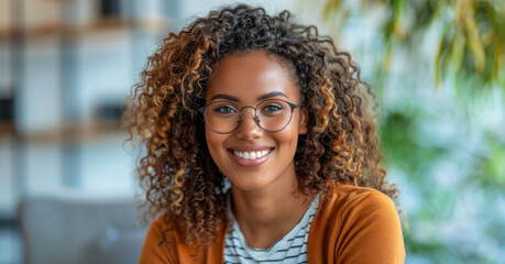 Poster - Smiling young businesswoman in a modern office setting