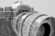 A close up of a camera lens with a wireframe