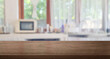 brown wooden table top on blur cafe minimal kitchen counter at background in bright color mood and tone for montage product display or design key visual layout. empty table space.