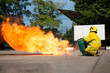 Fire and rescue emergency training by a firefighter who carefully and extinguishing a fire