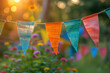 Party Colorful Flags Decoration on Blurry Background,
Colorful pennant string decoration in green tree foliage on blue sky summer party background