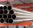Pipes stack, straight copper. Industrial pieces of pipelines for conduit, factory or construction works. High quality photo 