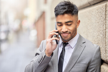 Canvas Print - Phone call, business man and wall in city for talking, conversation and salesman listening to contact for news. Mobile, Indian professional and discussion outdoor for deal, negotiation or network