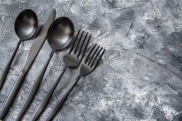 Poster - Group of spoons and forks arranged on a table. Perfect for restaurant or kitchen themed designs