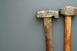 Two hammers placed side by side. Suitable for construction or DIY projects