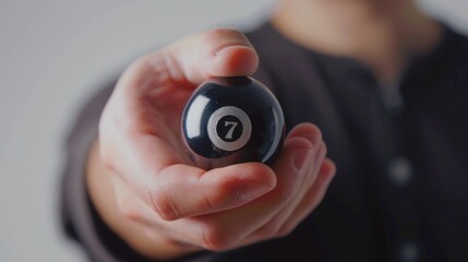 Poster - A person holding a pool ball. Suitable for sports and leisure concepts