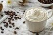 A cup of coffee with whipped cream and coffee beans, perfect for coffee shop promotions