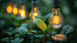 Electric lamps hangs above the green plants on the blurred greenhouse background
