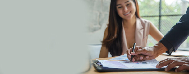 Concept Signing agreement on contract. Group of business man and woman meeting with marketing team to sign contract agreement on paper after success deal at office-banner image.