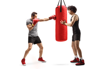 Canvas Print - Men training box with a punching bag