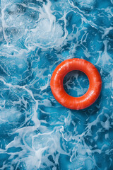 red swimming pool ring floating on the calm water in the swimming pool. High angle view with copy space. High quality photo