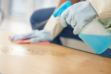 Sticker - Cleaning, hands in gloves and spray at table in living room of home for domestic chores or housework. Bacteria, bottle and product to wipe with person in apartment for disinfection or housekeeping