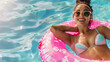 © ksu_ok - Attractive woman in swimsuit in the rubber ring in the swimming pool