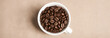 Coffee cup and roasted beans. Food banner