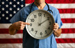 Health: Male Doctor Holds Analog Clock