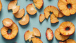 Symmetrical Display of Dried Pineapple Rings Creating Shadows on a Peach Background. Flat Lay Composition.