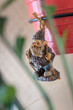 A small figure of a dwarf hanging.