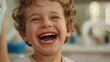 © somneuk - Children's dentistry. Live funny photo of a laughing child at the dentist's appointment.