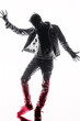© EdvvinStudios - Silhouetted man performing an energetic dance move in a studio