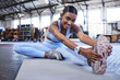 Portrait, woman and stretching in gym for wellness, happy and athlete for health goal in fitness club. Sports, training and smile for exercise or challenge activity, workout for energy and leg muscle