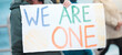 People, protest and sign with billboard for unity, community or freedom together in march. Closeup of activist, group or crowd in rally with poster or banner for strike, human rights or equality