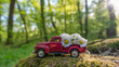 Red retro car carry daisy flowers in the magical forest
