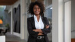 portrait of smiling black woman attorney in black suit, professional trustworthy, lawyer