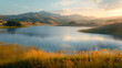 © ELmidoi-AI - A serene lake surrounded by hills, illuminated by dawn, provides a serene environment for morning fishing, kayaking, and peaceful reflection.