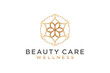 Golden color mandala pattern logo design for spa and beauty brand identity.
