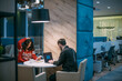 © Anna - Man and woman work in coworking in the evening