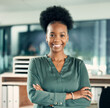 © peopleimages.com - African woman, portrait and office with arms crossed, smile and confidence for goals. Creative writer, professional news editor and expert reporter for content creation, publishing and press startup