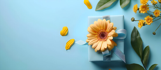 Wall Mural - Father's Day layout with ribbon, gift box, and yellow flower on blue background for mockup design. Ideal for Father's Day-themed promotion or greeting card design.