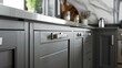 Contemporary meets classic in gray kitchen doors, enhanced by vintage-style stainless steel handles