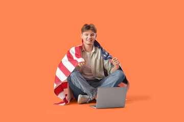 Sticker - Young man with flag of USA and laptop sitting on orange background