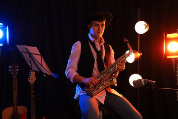 Poster - Male artist with saxophone performing on stage