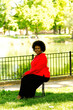 Attractive Middle Aged African American Woman Sitting Outdoors