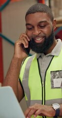 Canvas Print - Man, phone call and order in warehouse with laptop for distribution, networking and happy with review. African worker, smartphone and talking with supplier for sales with inventory, shipping or cargo