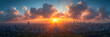 Cityscape at sunset panorama banner - top view o,
A sunset over the ocean with clouds and the sun above it
