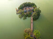 Aerial drone top view of Ngoc Son temple with The Huc bridge, Hoan Kiem lake, Hanoi city